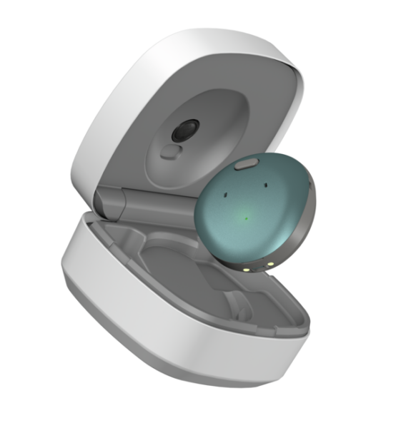 The Osia 3 Sound Processor with the new dark green colored cover, being shown hovering above the new Osia on-the-go charging case. 